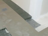 Perimeters installed along wall.  Carpet will be cust and installed as the last step