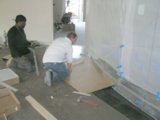 Cutting perimeters to conform to a curved wall.  Carpet will be cut and installed as a last step.
