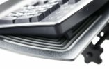 Aurora style tray.  Grooved in back corners to firmly hold the keyboard.